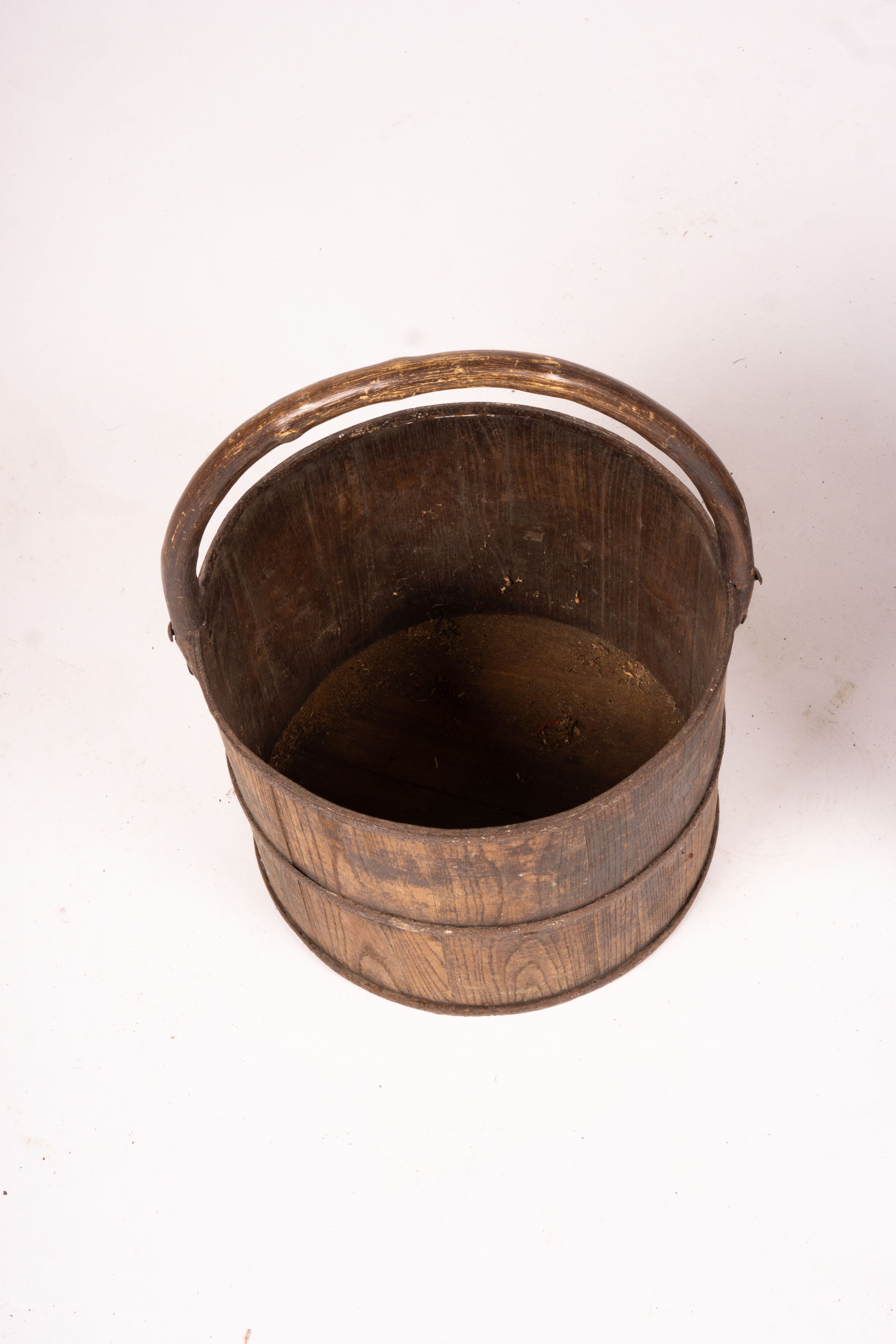 A Chinese staved wood rice carrier together with a circular iron bound staved wood bucket, larger 35cm diameter, height 52cm